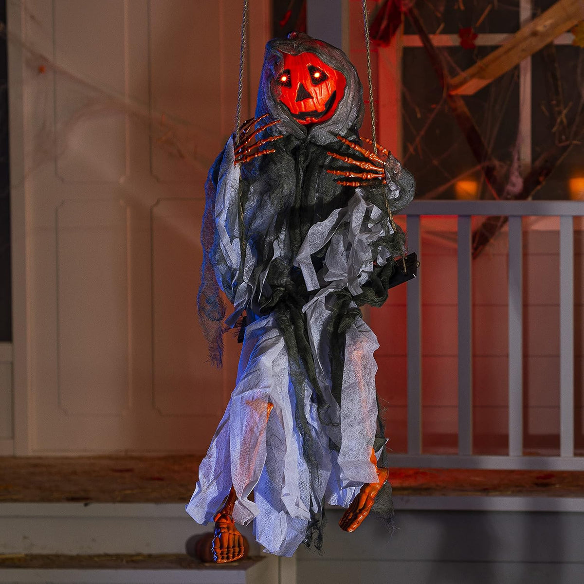 Hanging Halloween pumpkin decoration with illuminated face