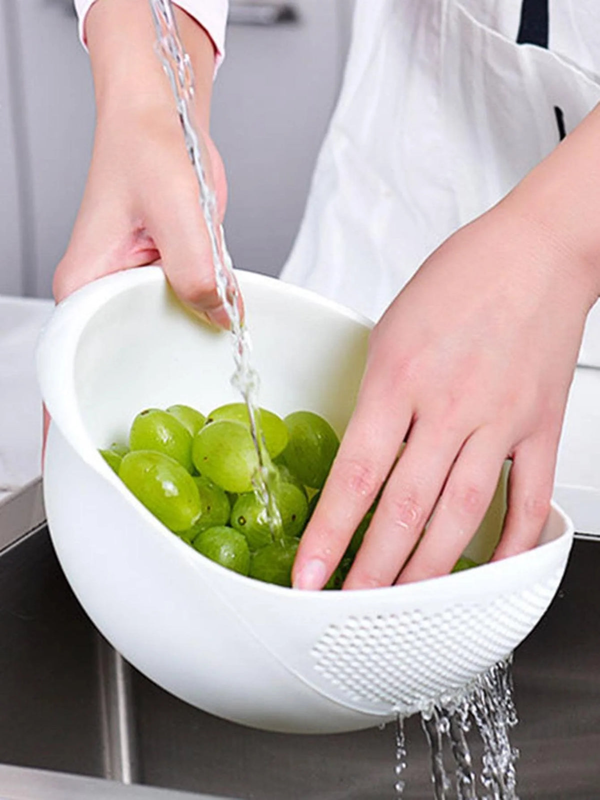 Washing fruit in drain basket