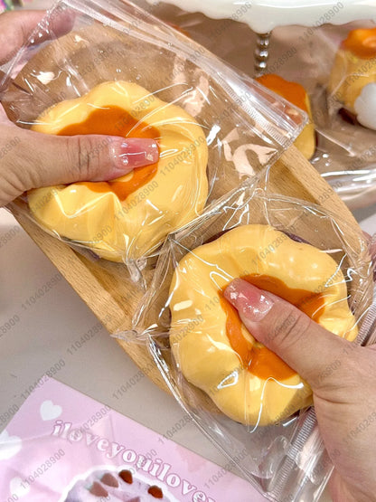 Cute caramel pudding fidget squishy inside its protective pouch