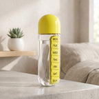 Black 20oz water bottle with organized pill compartments for daily use