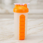 Water bottle and seven compartment pill organizer for travel and outdoor activities