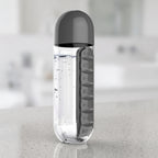 2-in-1 600ml black water bottle with seven compartment pill organizer