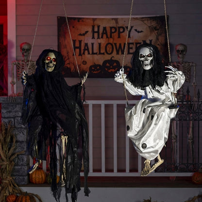 Glowing LED Halloween decorations hanging from a tree
