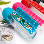 Portable black water bottle with integrated capsule and medicine organizer