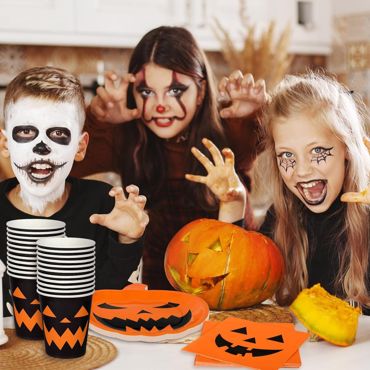 Orange black Halloween dinnerware set arranged for a spooky themed party