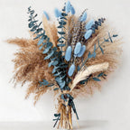 Boho dried flower arrangement in dusty blue and beige tones for home decor