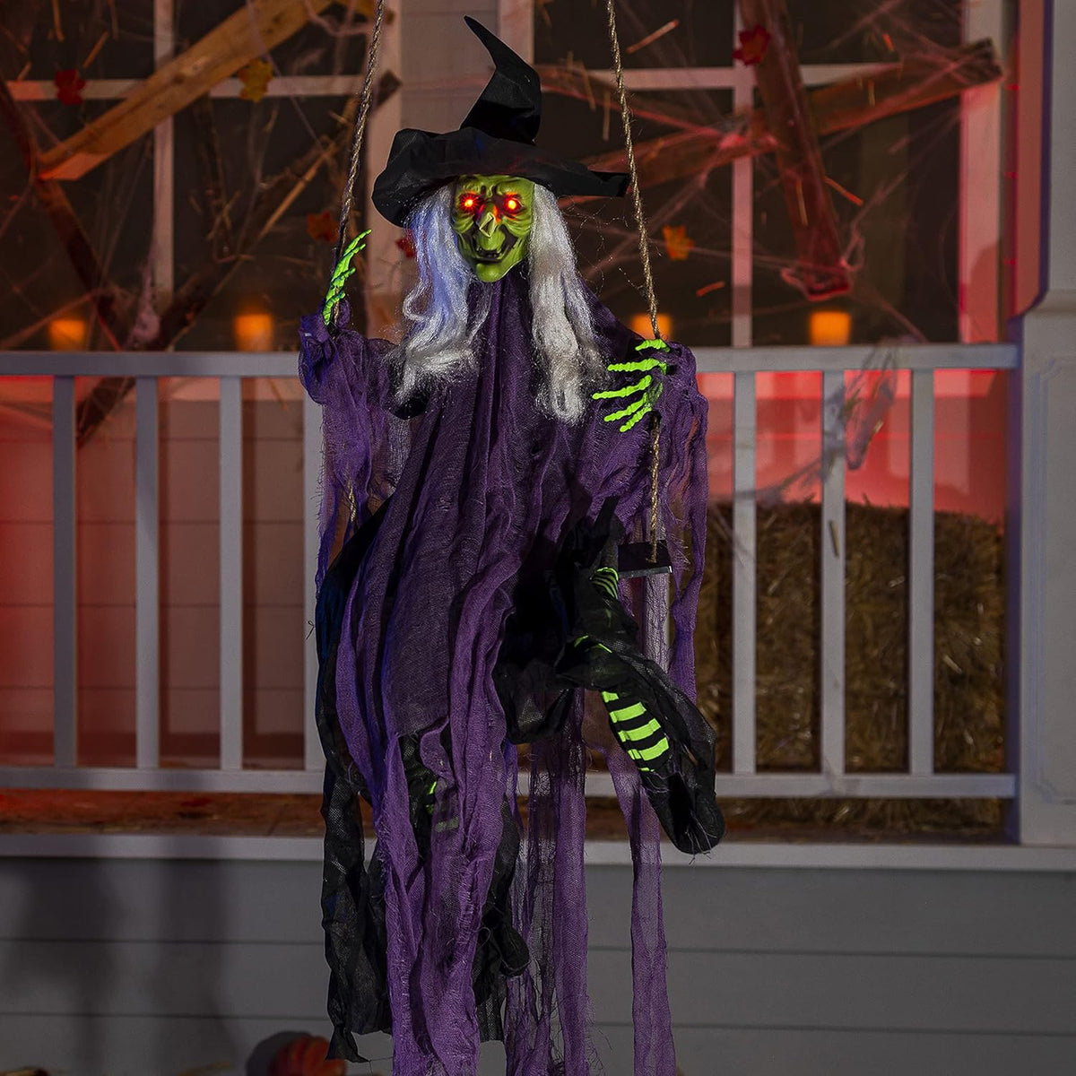 Hanging Halloween witch decoration with glowing eyes