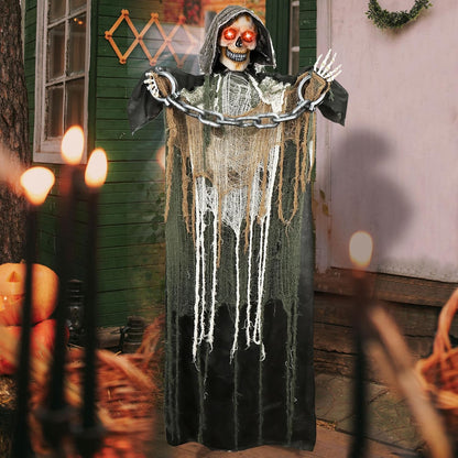 Life size Halloween Grim Reaper standing in outdoor yard
