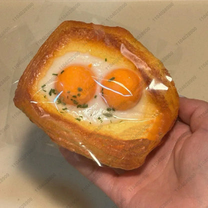 Large fried egg toast fidget squishy for squeezing, relaxation, and sensory play