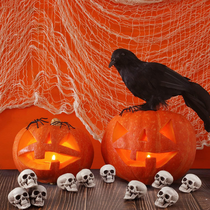 Small plastic skeleton skulls with detailed teeth and eye sockets