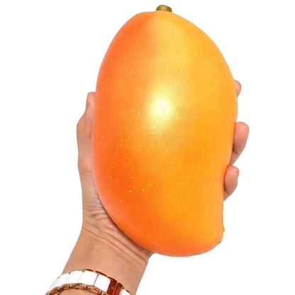 Jumbo gold mango squishy with realistic fruit-inspired design