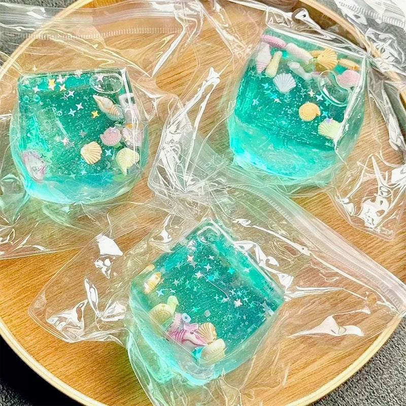 Clear maltose squishy cube with shells inside