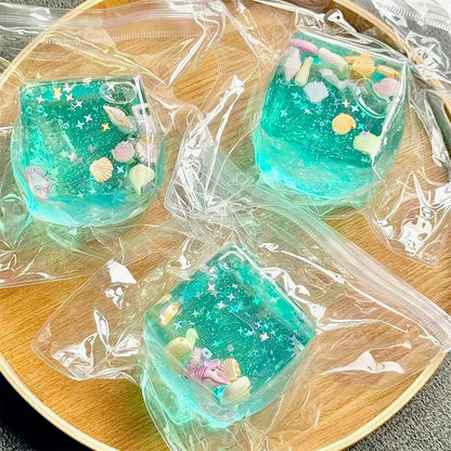 Clear maltose squishy cube with shells inside