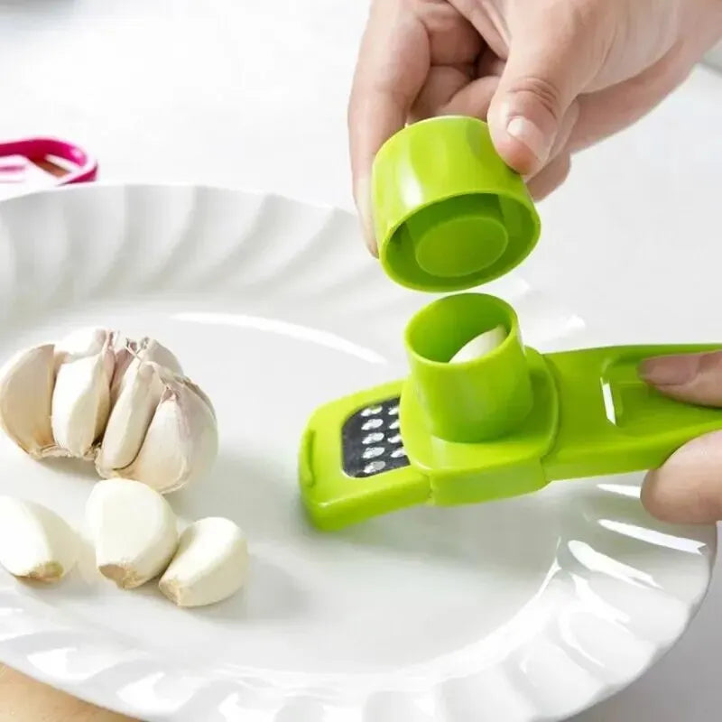 Mashing garlic cloves with mini garlic grinder