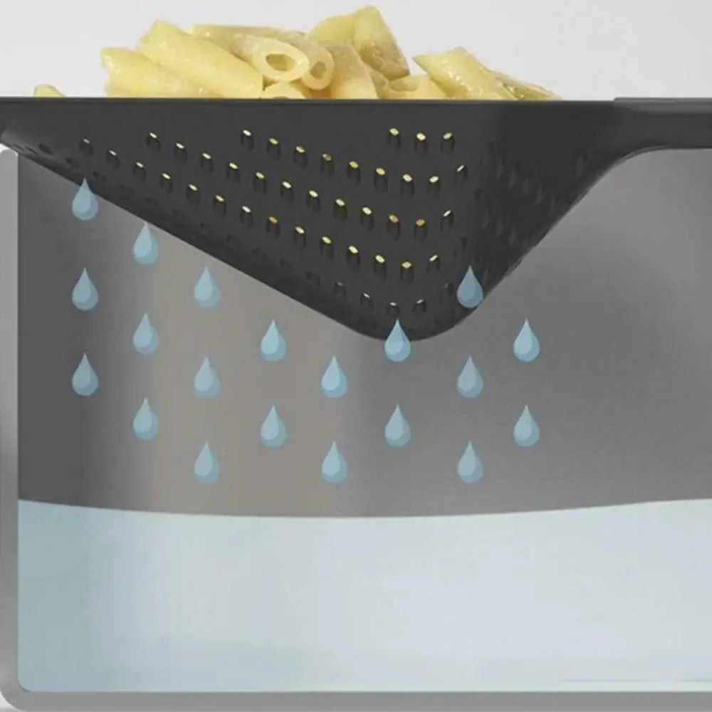 Slotted skimmer lifting fried food from oil