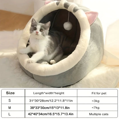 Cat sleeping in cozy cave nest