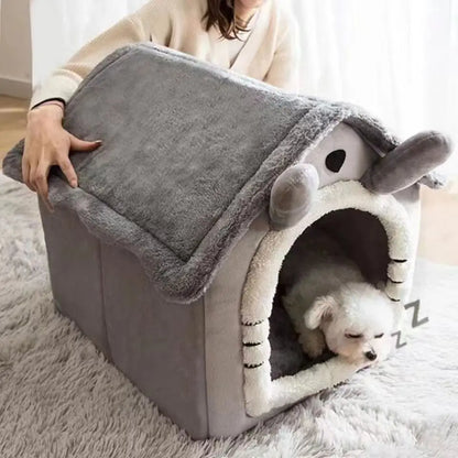 Cat resting in house-style pet bed