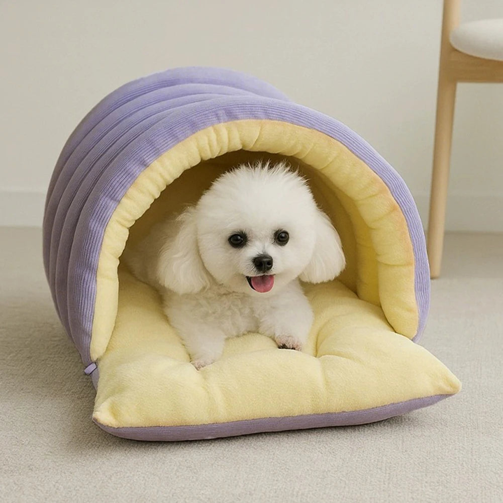 Cat sleeping inside plush cave bed