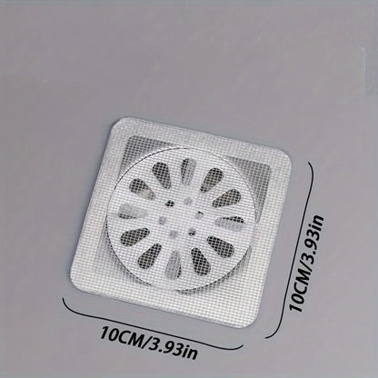 Hair catcher sticker over shower floor drain