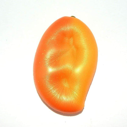 Large gold mango squishy stress relief toy for squeezing and sensory play